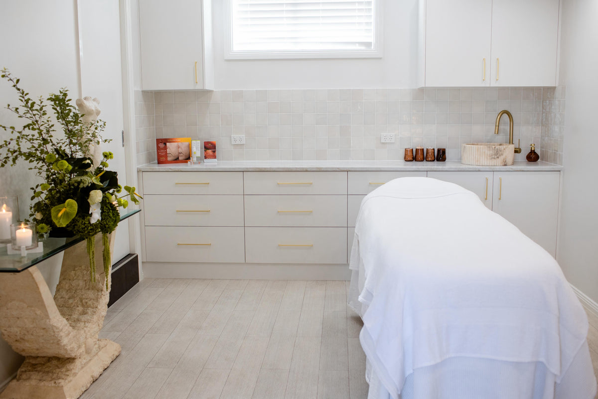 Calm and welcoming treatment space at LillyRose Beauty featuring warm, neutral interiors.
